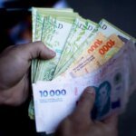 Argentinos investem bilhões em compras no exterior e intensificam a crise cambial